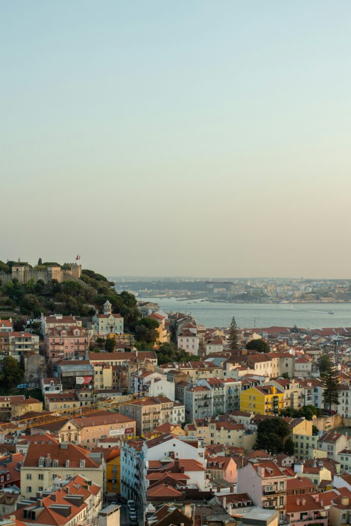Alfama district with colourful tiled buildings and a tram