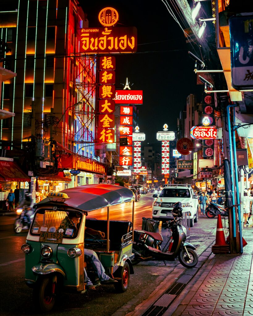 Chinatown Yaowarat Road lit up at night with food stalls]