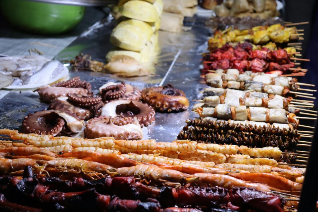 Grilled seafood skewers at Forodhani Gardens night market